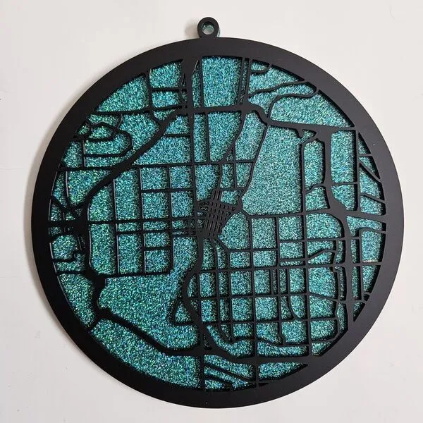 Laser cut street map ornament with turquoise background